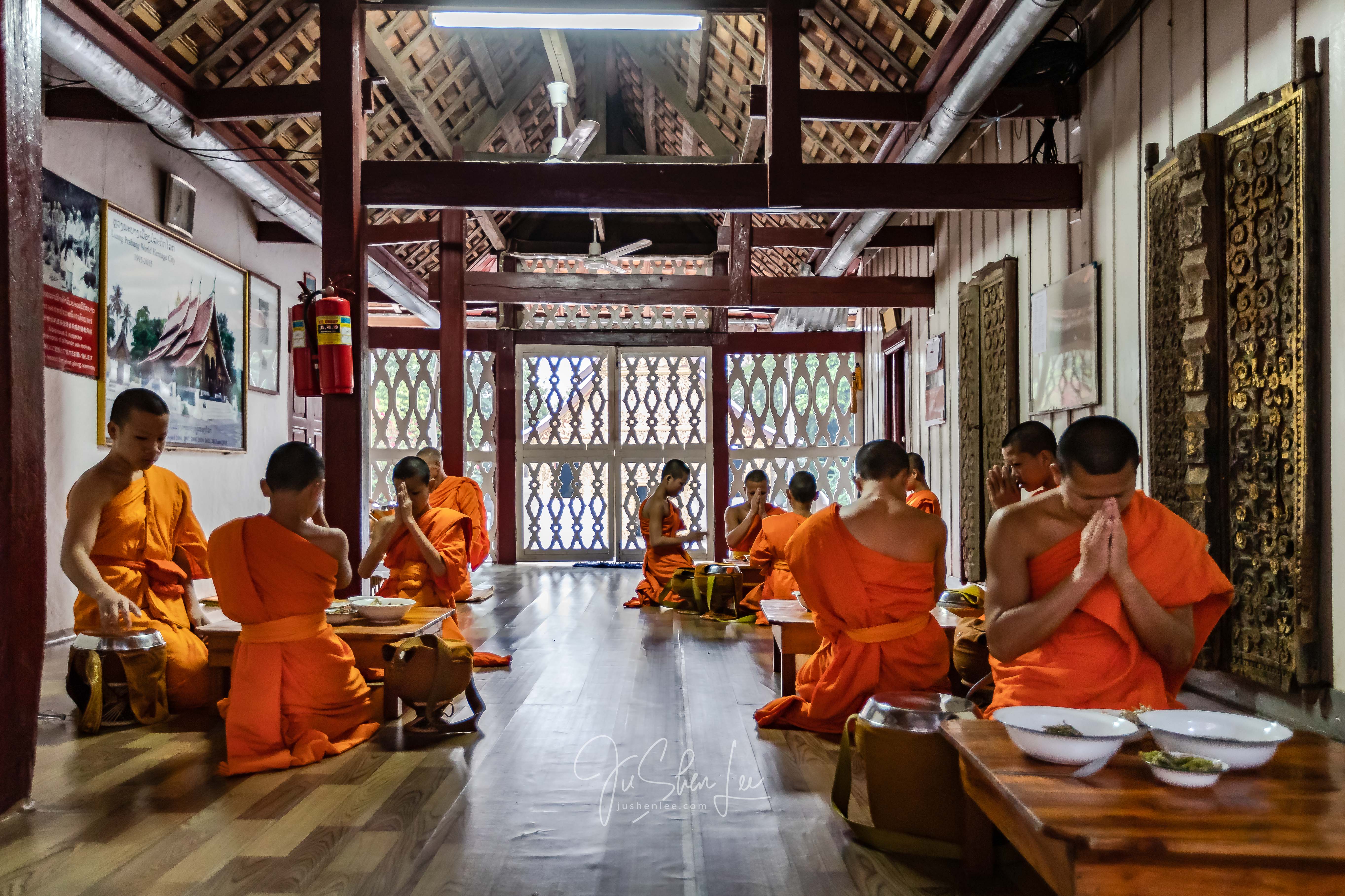 Monks eating together in Luang Prabang, Laos