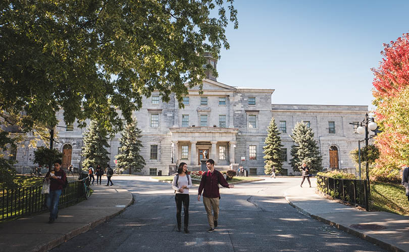 Photo of two students in front of the Arts building