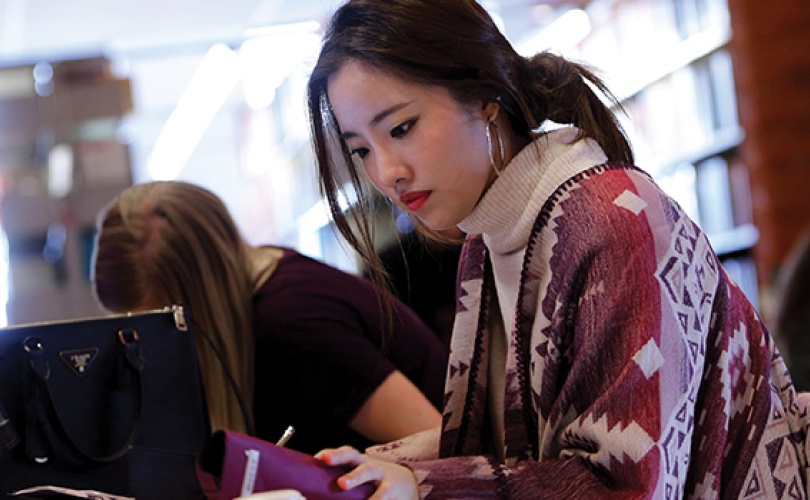 Photo of a student in the library