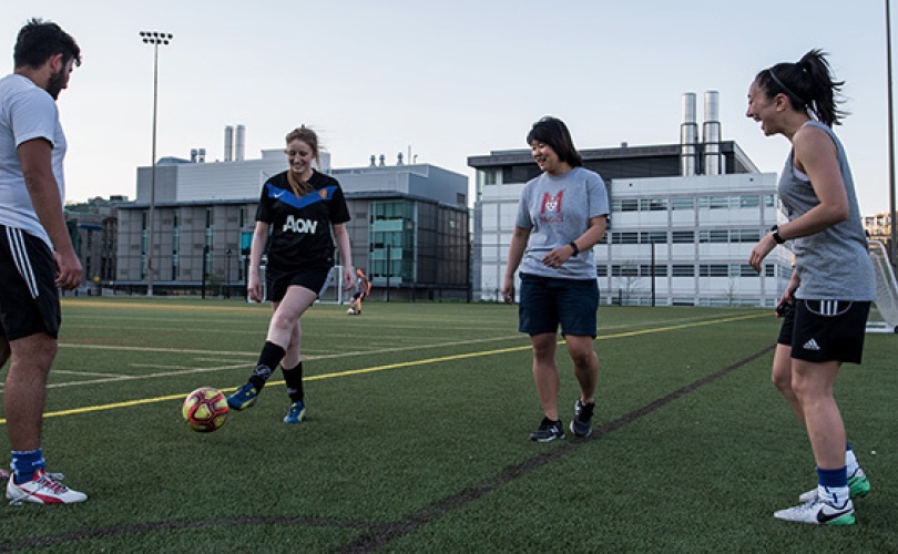 Students playing soccer