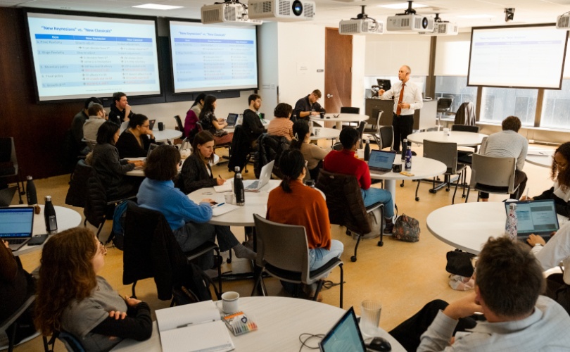 A group of people sitting around tables