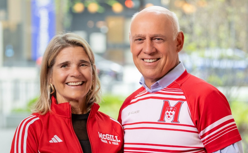 Woman and man wearing McGill colours