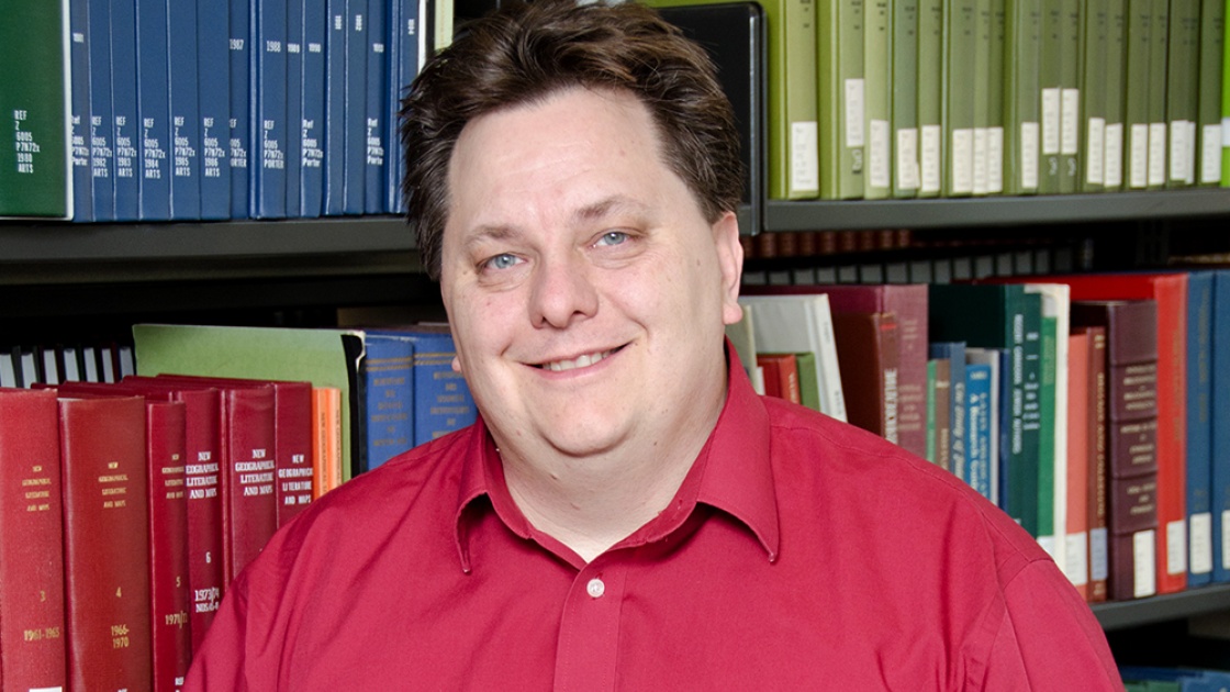 PASCAL CALARCO in a library