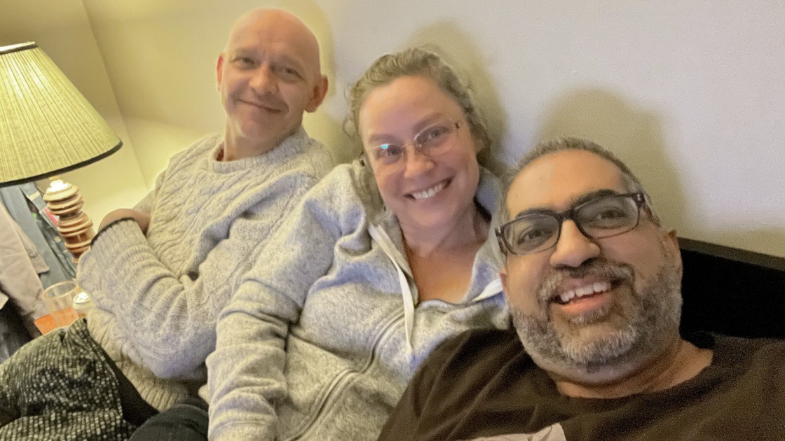 Bobby Umar and two friends on a couch