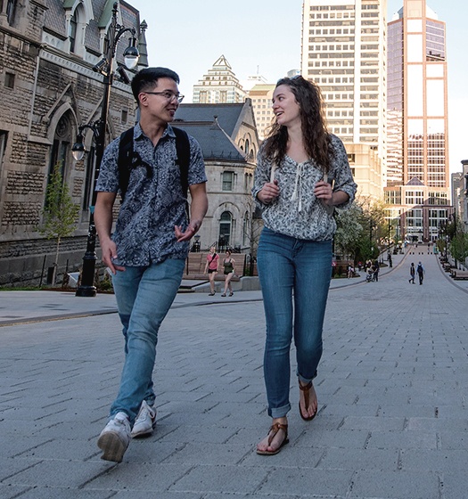 Two students walking on McTavish