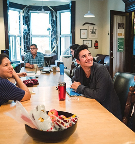 A group of people sitting around a table