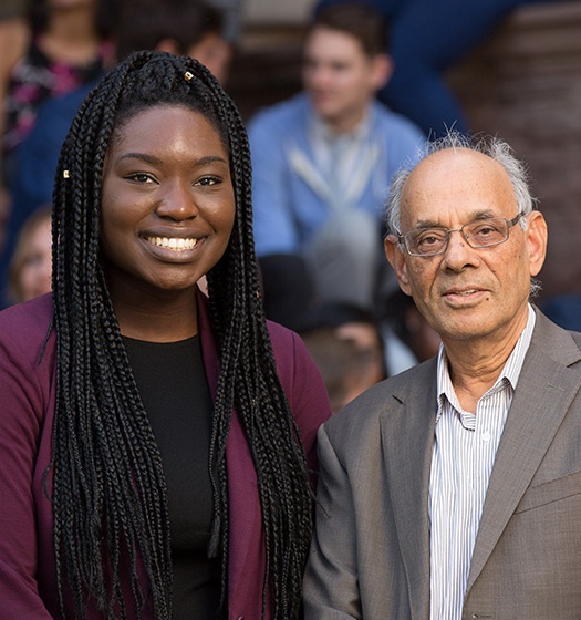 Two people smiling at camera